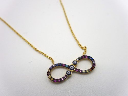 Collar de plata bañada en oro con infinito de circonitas tintadas de colores y ojo turco
