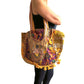 Bolso bohemio amarillo con pompones