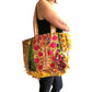 Bolso bohemio amarillo con pompones