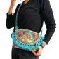 Bolso bohemio bandolera de patchwork con pompones