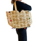 Bolso bohemio dorado con pompones
