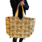 Bolso bohemio dorado con pompones