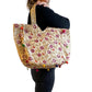 Bolso bohemio dorado con pompones