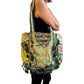 Bolso bohemio verde con pompones