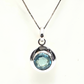 Colgante de plata con topacio azul